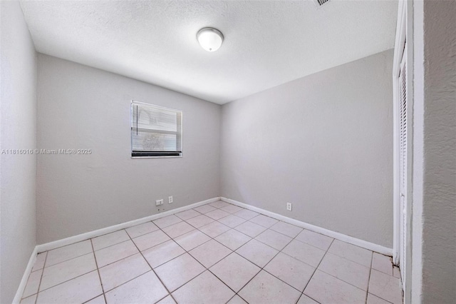 6359 SW 1st St, Margate, FL 33068 - spare room featuring light tile patterned floors, baseboards, and a textured ceiling
