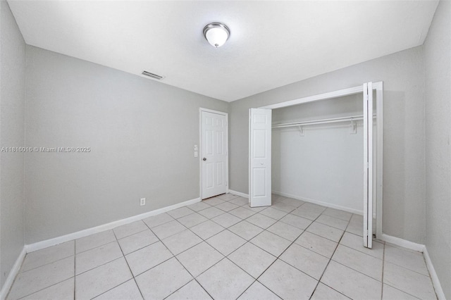 6359 SW 1st St, Margate, FL 33068 - unfurnished bedroom featuring baseboards, a closet, and light tile patterned flooring