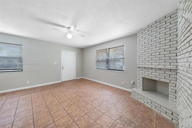 6359 SW 1st St, Margate, FL 33068 - unfurnished living room featuring a ceiling fan, a textured ceiling, tile patterned floors, a brick fireplace, and baseboards