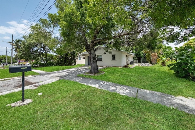 6359 SW 1st St, Margate, FL 33068 - view of grassy yard featuring driveway