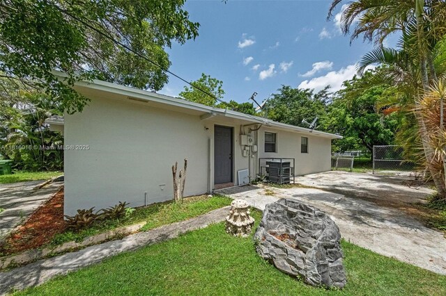 6359 SW 1st St, Margate, FL 33068 - rear view of house featuring stucco siding
