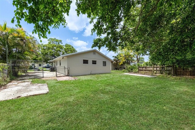 6359 SW 1st St, Margate, FL 33068 - view of yard featuring a gate