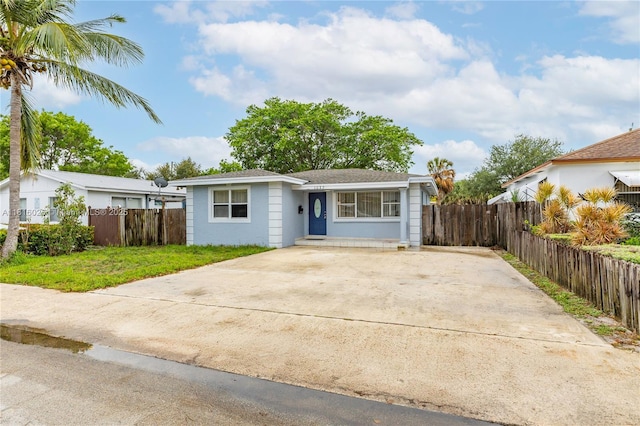 1023 N F St, Lake Worth, FL 33460 - view of front of house with concrete driveway