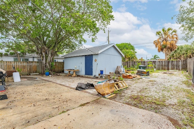 1023 N F St, Lake Worth, FL 33460 - back of property featuring a patio and a fenced backyard