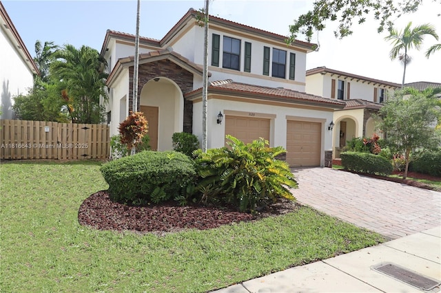 9120 SW 227th Ter, Cutler Bay, FL 33190 - mediterranean / spanish-style house featuring stucco siding, a tile roof, an attached garage, and driveway