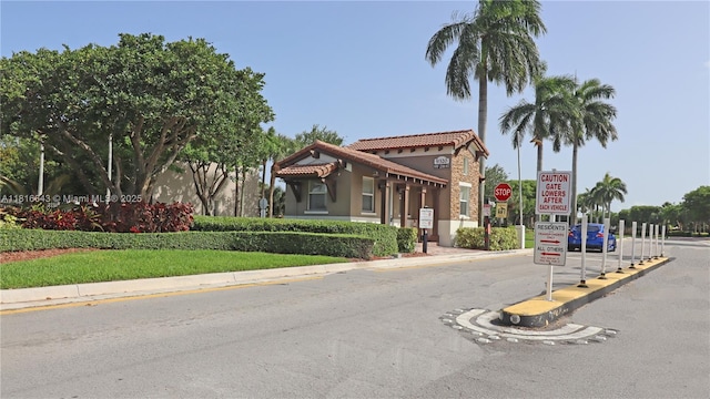 9120 SW 227th Ter, Cutler Bay, FL 33190 - view of asphalt road with traffic signs and curbs