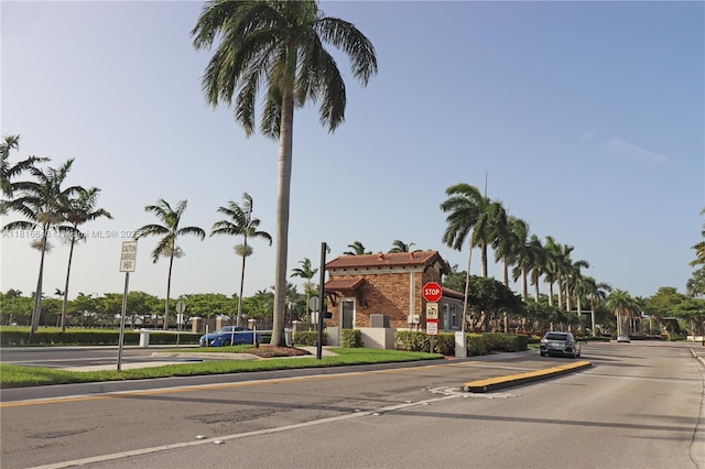 9120 SW 227th Ter, Cutler Bay, FL 33190 - view of asphalt street with traffic signs, curbs, and street lighting