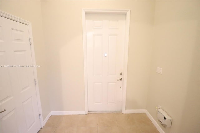 9120 SW 227th Ter, Cutler Bay, FL 33190 - entryway featuring baseboards and light tile patterned flooring