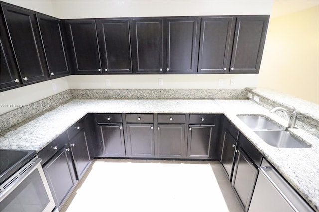 9120 SW 227th Ter, Cutler Bay, FL 33190 - kitchen with dishwasher, light stone counters, stainless steel electric range, and dark cabinetry