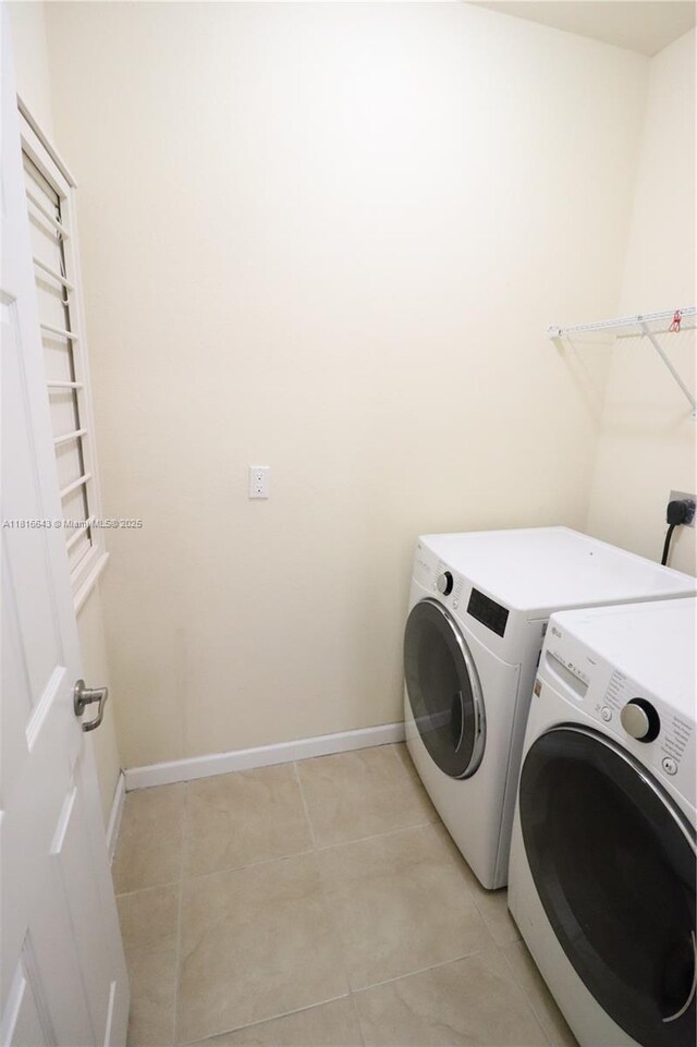 9120 SW 227th Ter, Cutler Bay, FL 33190 - washroom with independent washer and dryer and light tile patterned floors