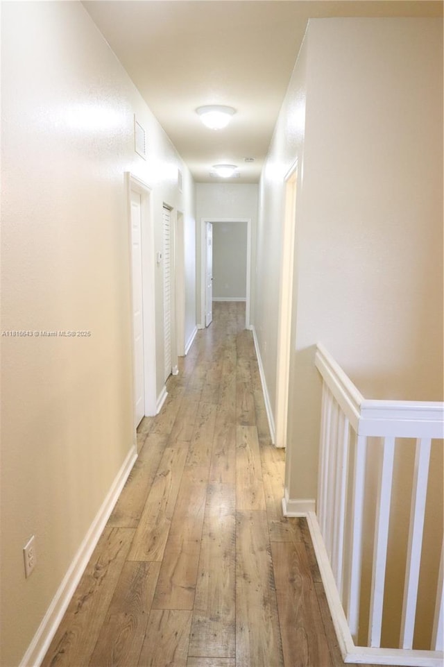 9120 SW 227th Ter, Cutler Bay, FL 33190 - corridor featuring light wood finished floors and baseboards