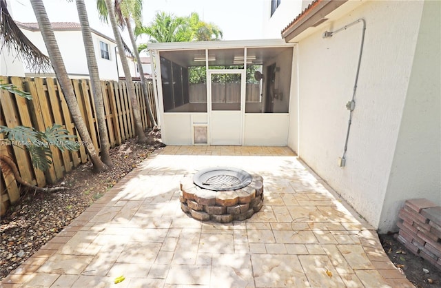 9120 SW 227th Ter, Cutler Bay, FL 33190 - view of patio / terrace featuring a sunroom and an outdoor fire pit