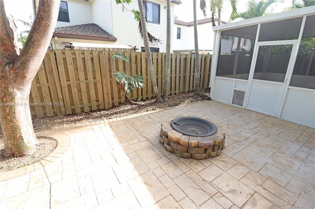 9120 SW 227th Ter, Cutler Bay, FL 33190 - view of patio / terrace with a sunroom and a fire pit