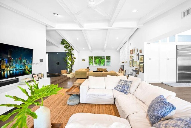 7761 SW 170th St, Palmetto Bay, FL 33157 - living room with wood finished floors, beamed ceiling, a ceiling fan, recessed lighting, and a brick fireplace