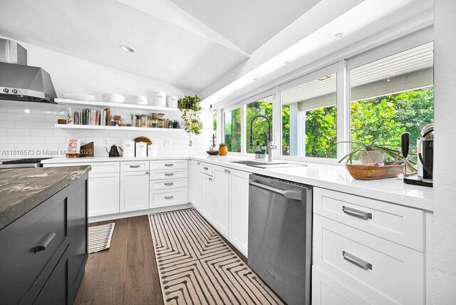7761 SW 170th St, Palmetto Bay, FL 33157 - kitchen with stainless steel dishwasher, wall chimney range hood, tasteful backsplash, open shelves, and vaulted ceiling