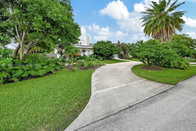 7761 SW 170th St, Palmetto Bay, FL 33157 - swimming pool featuring an outdoor living space, a wooden deck, and a patio