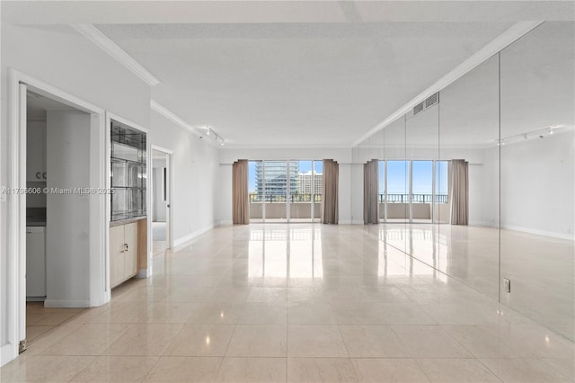 201 Crandon Blvd Unit 633, Key Biscayne, FL 33149 - unfurnished room featuring ornamental molding, plenty of natural light, and light tile patterned flooring