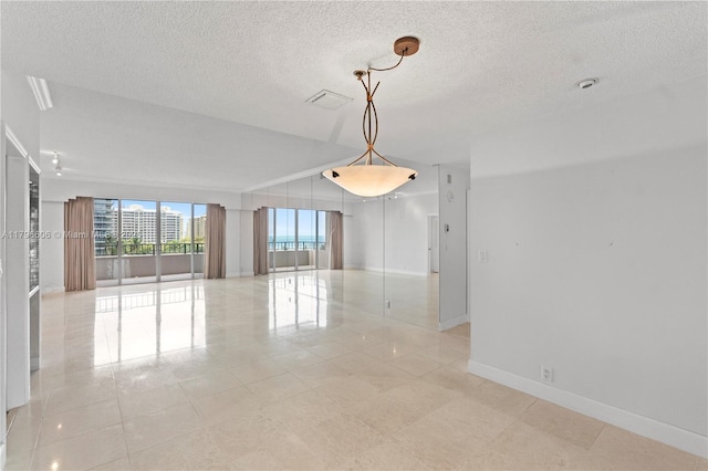 201 Crandon Blvd Unit 633, Key Biscayne, FL 33149 - unfurnished room with light tile patterned floors and a textured ceiling