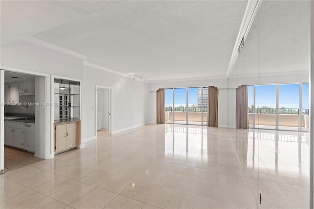 201 Crandon Blvd Unit 633, Key Biscayne, FL 33149 - unfurnished room featuring crown molding, light tile patterned floors, and a textured ceiling