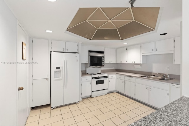 201 Crandon Blvd Unit 633, Key Biscayne, FL 33149 - kitchen featuring white appliances, recessed lighting, white cabinetry, light countertops, and light tile patterned floors