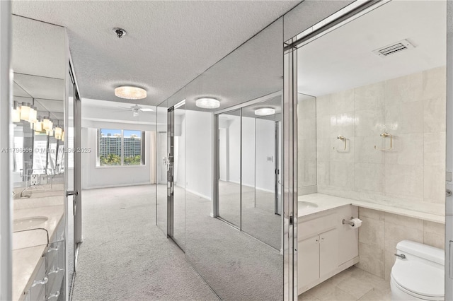 201 Crandon Blvd Unit 633, Key Biscayne, FL 33149 - bathroom with vanity, a ceiling fan, and a textured ceiling