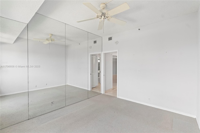 201 Crandon Blvd Unit 633, Key Biscayne, FL 33149 - unfurnished bedroom with carpet, a closet, and a ceiling fan