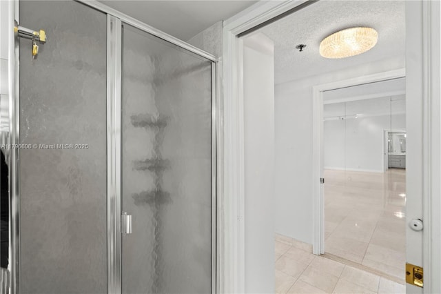 201 Crandon Blvd Unit 633, Key Biscayne, FL 33149 - bathroom with a shower stall, tile patterned floors, and a textured ceiling