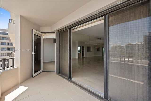 201 Crandon Blvd Unit 633, Key Biscayne, FL 33149 - view of exterior entry with a balcony and stucco siding