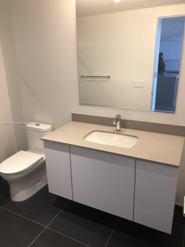1600 NE 1st Ave Unit 3319, Miami, FL 33132 - half bath with vanity, tile patterned flooring, and toilet