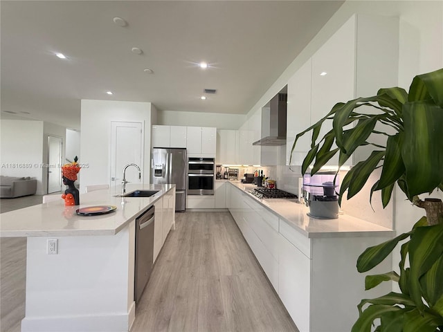 8167 NW 45th St, Doral, FL 33166 - kitchen with modern cabinets, a sink, wall chimney exhaust hood, stainless steel appliances, and white cabinetry