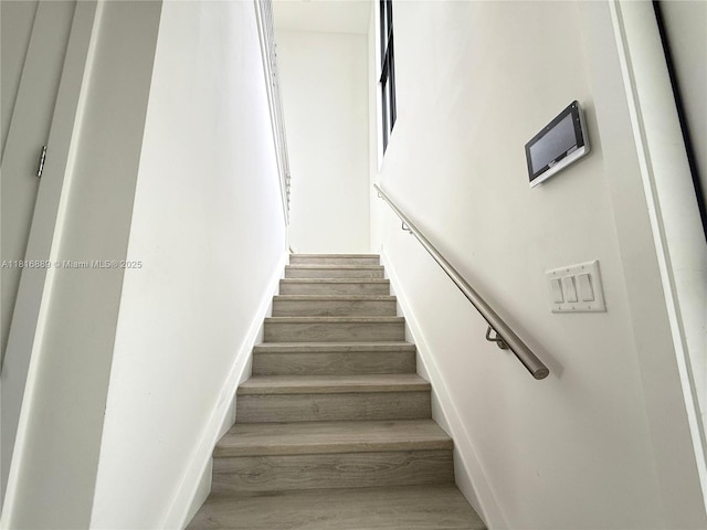 8167 NW 45th St, Doral, FL 33166 - stairway featuring wood finished floors and baseboards