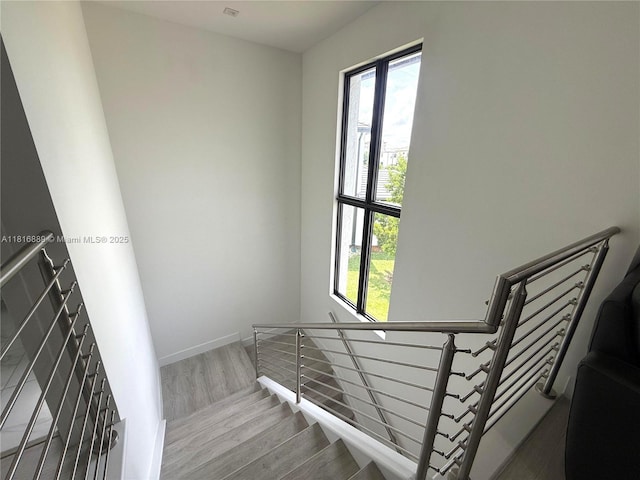 8167 NW 45th St, Doral, FL 33166 - staircase with wood finished floors, plenty of natural light, and baseboards