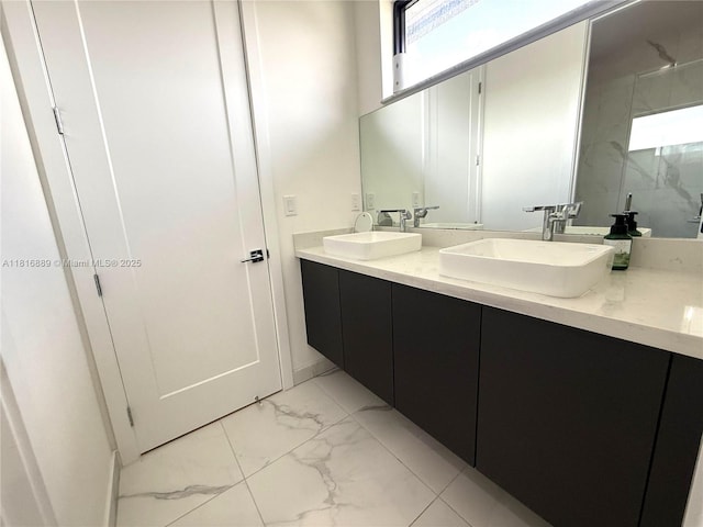 8167 NW 45th St, Doral, FL 33166 - bathroom featuring marble finish flooring, double vanity, and healthy amount of natural light