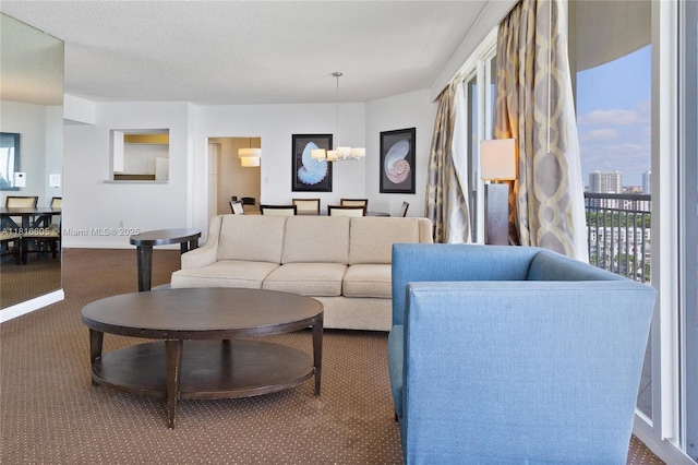 17375 Collins Ave Unit 1908, Sunny Isles Beach, FL 33160 - living room featuring carpet floors, a chandelier, and baseboards