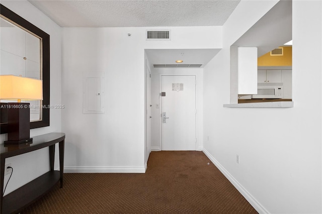 17375 Collins Ave Unit 1908, Sunny Isles Beach, FL 33160 - hall with carpet, electric panel, baseboards, and a textured ceiling