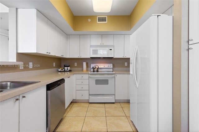 17375 Collins Ave Unit 1908, Sunny Isles Beach, FL 33160 - kitchen featuring white appliances, light countertops, and white cabinets