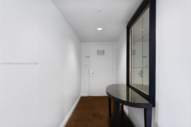 17375 Collins Ave Unit 1908, Sunny Isles Beach, FL 33160 - hallway with baseboards, dark colored carpet, and recessed lighting