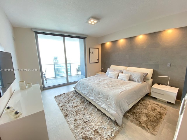 488 NE 18th St Unit 3911, Miami, FL 33132 - bedroom featuring access to exterior, expansive windows, and a textured ceiling
