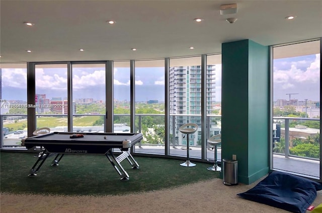 488 NE 18th St Unit 3911, Miami, FL 33132 - recreation room with carpet floors, a city view, floor to ceiling windows, healthy amount of natural light, and recessed lighting