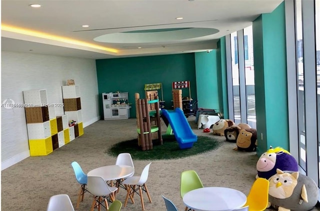 488 NE 18th St Unit 3911, Miami, FL 33132 - recreation room featuring carpet floors, a wall of windows, and a tray ceiling