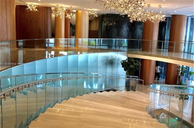 488 NE 18th St Unit 3911, Miami, FL 33132 - stairway with a chandelier and wood finished floors