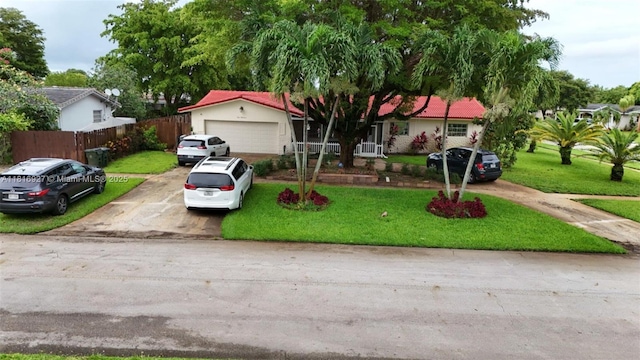 400 NW 41st Ave, Coconut Creek, FL 33066 - ranch-style house with a garage and driveway