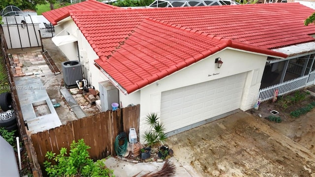 400 NW 41st Ave, Coconut Creek, FL 33066 - garage with central AC and driveway