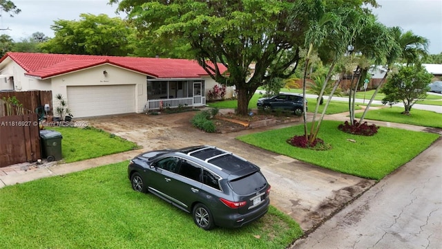 400 NW 41st Ave, Coconut Creek, FL 33066 - single story home featuring a front lawn, a garage, a tiled roof, covered porch, and driveway