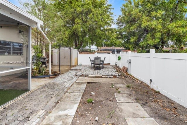 400 NW 41st Ave, Coconut Creek, FL 33066 - fenced backyard featuring a patio area and outdoor dining space