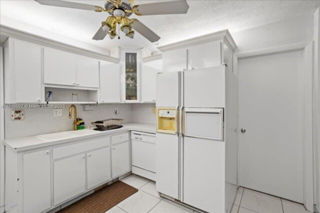 400 NW 41st Ave, Coconut Creek, FL 33066 - kitchen with white appliances, light countertops, white cabinetry, and ceiling fan
