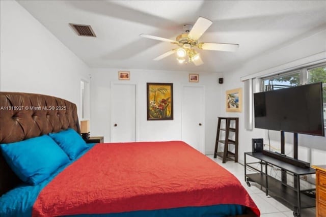 400 NW 41st Ave, Coconut Creek, FL 33066 - tiled bedroom with a ceiling fan