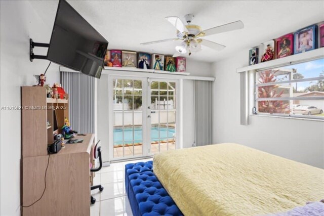 400 NW 41st Ave, Coconut Creek, FL 33066 - bedroom featuring access to outside, ceiling fan, light tile patterned floors, and french doors