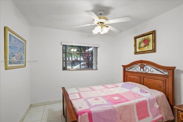 400 NW 41st Ave, Coconut Creek, FL 33066 - bedroom with a ceiling fan, baseboards, and light tile patterned flooring