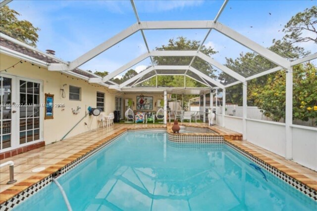 400 NW 41st Ave, Coconut Creek, FL 33066 - view of pool featuring a patio area, a pool with connected hot tub, and a lanai